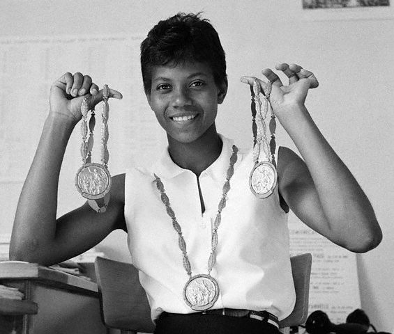 Wilma Rudolph poses with her three gold medals